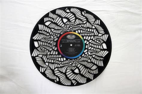 Making some CNC album art with a blue laser and a vinyl record.